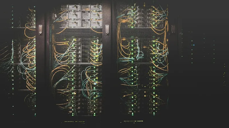 Datacenter corridor lined with server racks